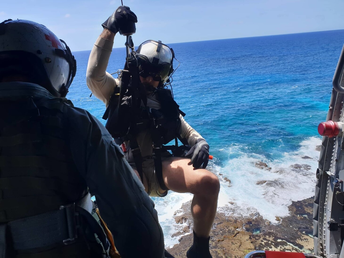 GUAM (Apr. 11, 2019) Naval Aircrewman (Helicopter) 1st Class William Medlin lowers Naval Aircrewman (Helicopter) 2nd Class Robert Washington, both assigned to the “Island Knights” of Helicopter Sea Combat Squadron (HSC) 25, to rescue two local spear fishermen after their personal watercraft sank off the east coast of Guam. HSC-25 provides a multi-mission rotary wing capability for units in the U.S. 7th Fleet area of operations and maintains a Guam-based 24-hour search-and-rescue and medical evacuation capability, directly supporting U.S. Coast Guard and Joint Region Marianas. HSC-25 is the Navy’s only forward-deployed MH-60S expeditionary squadron.