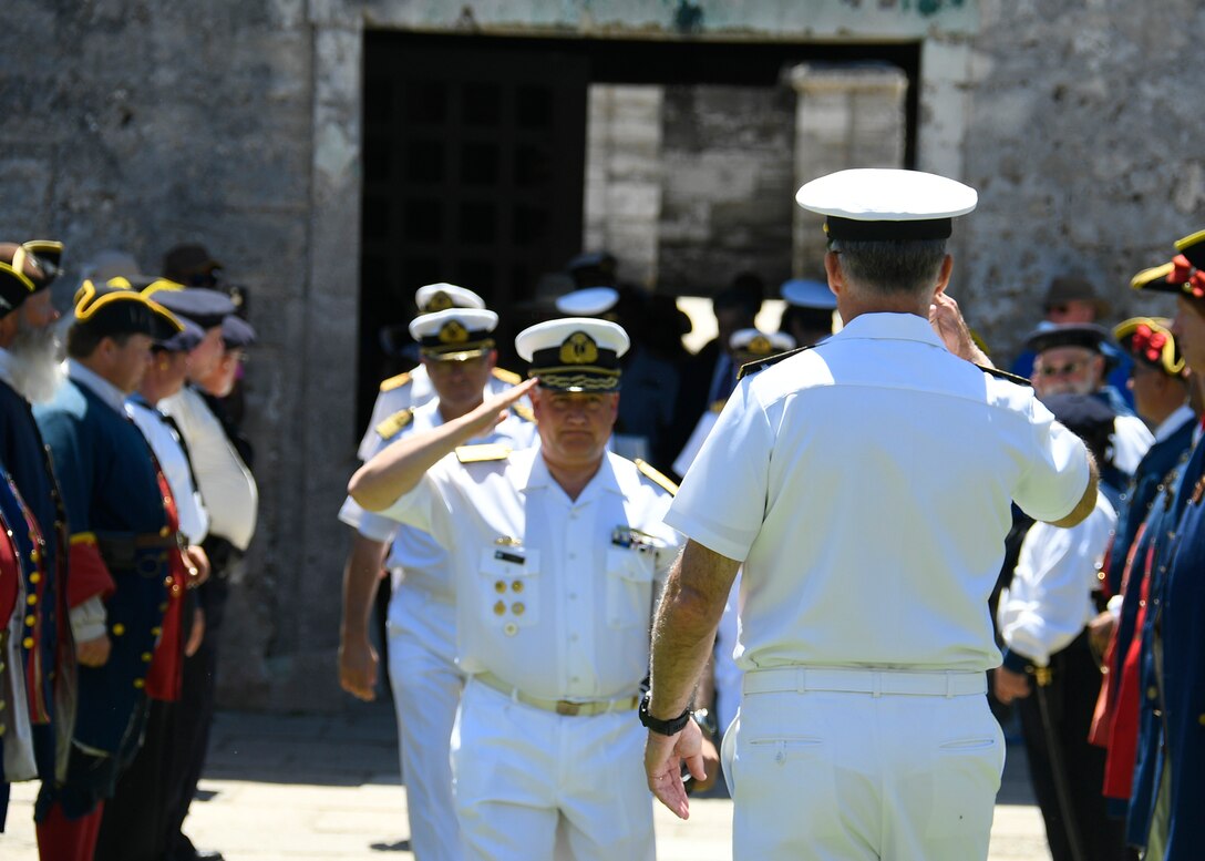 Commander, U.S. 4th Fleet, Rear Adm. Sean Buck salutes Argentine Commander, Navy Training and Readiness Command, Rear Adm. Fabian Gerardo D'Angelo.