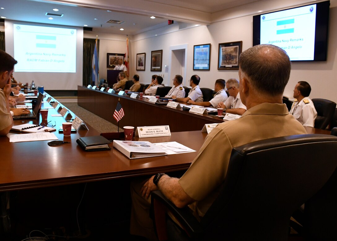 Rear Adm. Sean Buck and each staff listen to Argentine Commander, Navy Training and Readiness Command, Rear Adm. Fabian Gerardo D'Angelo.