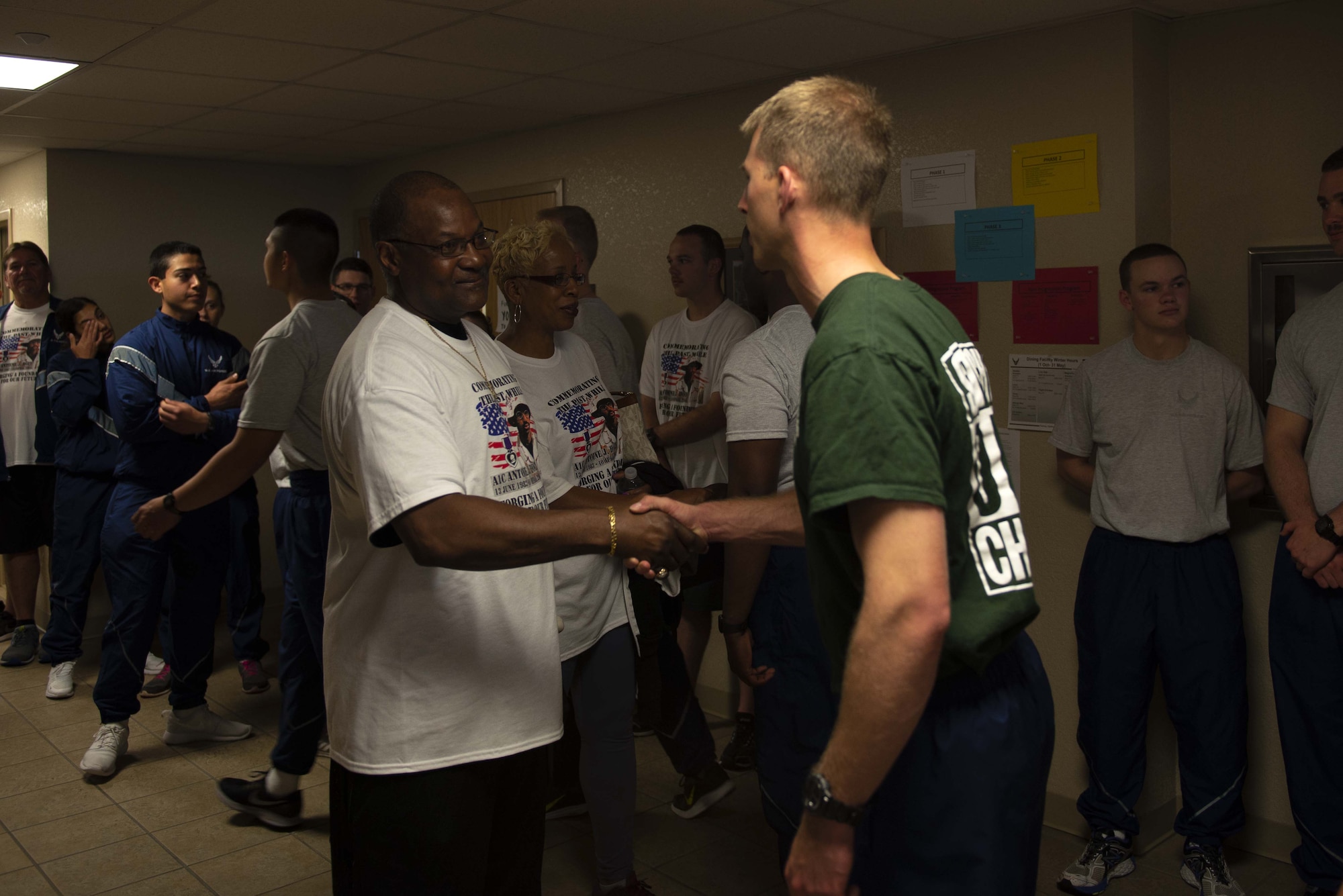 Michael Holt, U.S. Air Force Airman 1st Class Antoine Holt’s father, shakes hands with a 334th Training Squadron Airman at Keesler Air Force Base, Mississippi, April 5, 2019. During his visit, Michael told Antoine’s story, spoke with 334th TRS Airmen about resiliency and played basketball. (U.S. Air Force photo by Airman 1st Class Kimberly Mueller)