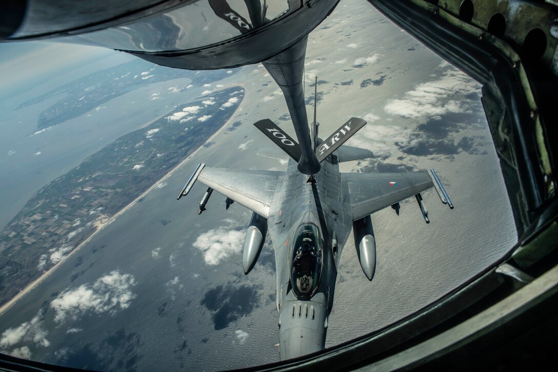 A Netherlands Royal Air Force F-16 Fighting Falcon receives fuel from a U.S. Air Force KC-135 Stratotanker during Exercise Frisian Flag over the Netherlands, April 10, 2019. The exercise included more than 50 aircraft from six different nations for the purpose of training joint and combined air operations in a broad spectrum of scenarios. (U.S. Air Force photo by Senior Airman Luke Milano)