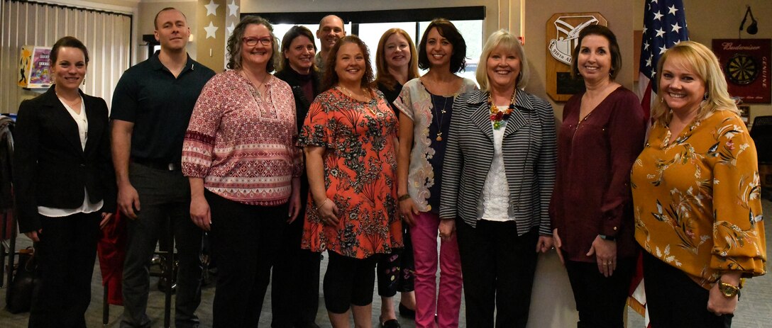 Suzie Schwartz (3rd from right), wife of the 19th Chief of Staff of the Air Force Gen. (retired) Norton Schwartz, poses with the YARS Key Spouse group at the Kubli Morale and Wellness Center here, April 6, 2019.
