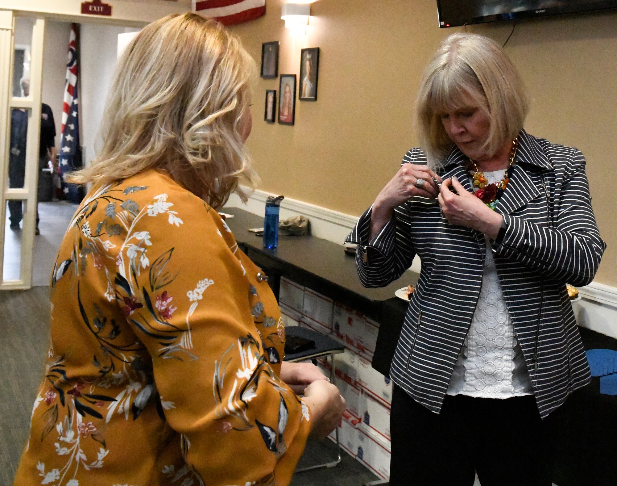 Suzie Schwartz (3rd from right), wife of the 19th Chief of Staff of the Air Force Gen. (retired) Norton Schwartz, poses with the YARS Key Spouse group at the Kubli Morale and Wellness Center here, April 6, 2019.