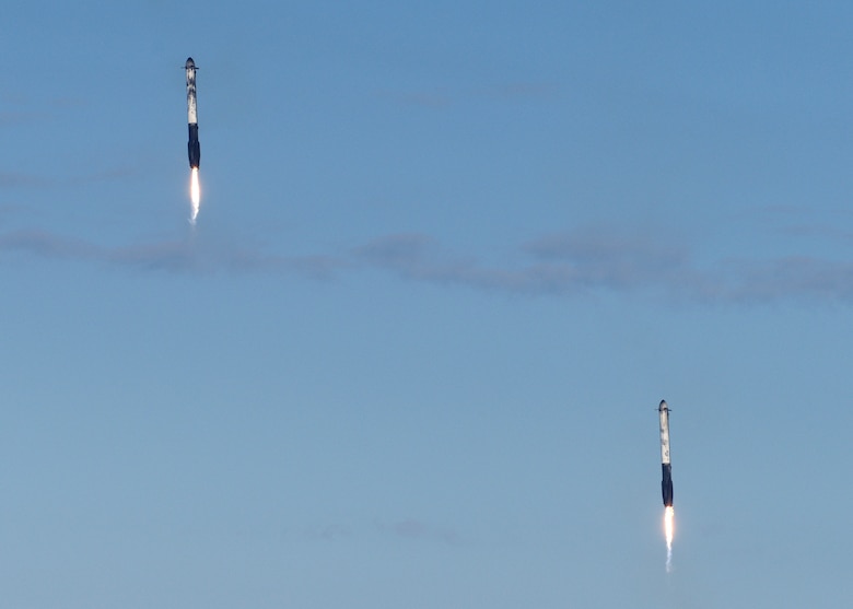 Two boosters sit atop a landing zone after the successful launch and landing of SpaceX's Falcon Heavy Arabsat 6A on April 12, 2019 at Kennedy Space Center, Fla. This marks the second launch of the Falcon Heavy rocket; the most powerful space vehicle flying today. (U.S. Air Force photo by Airman 1st Class Zoe Thacker)