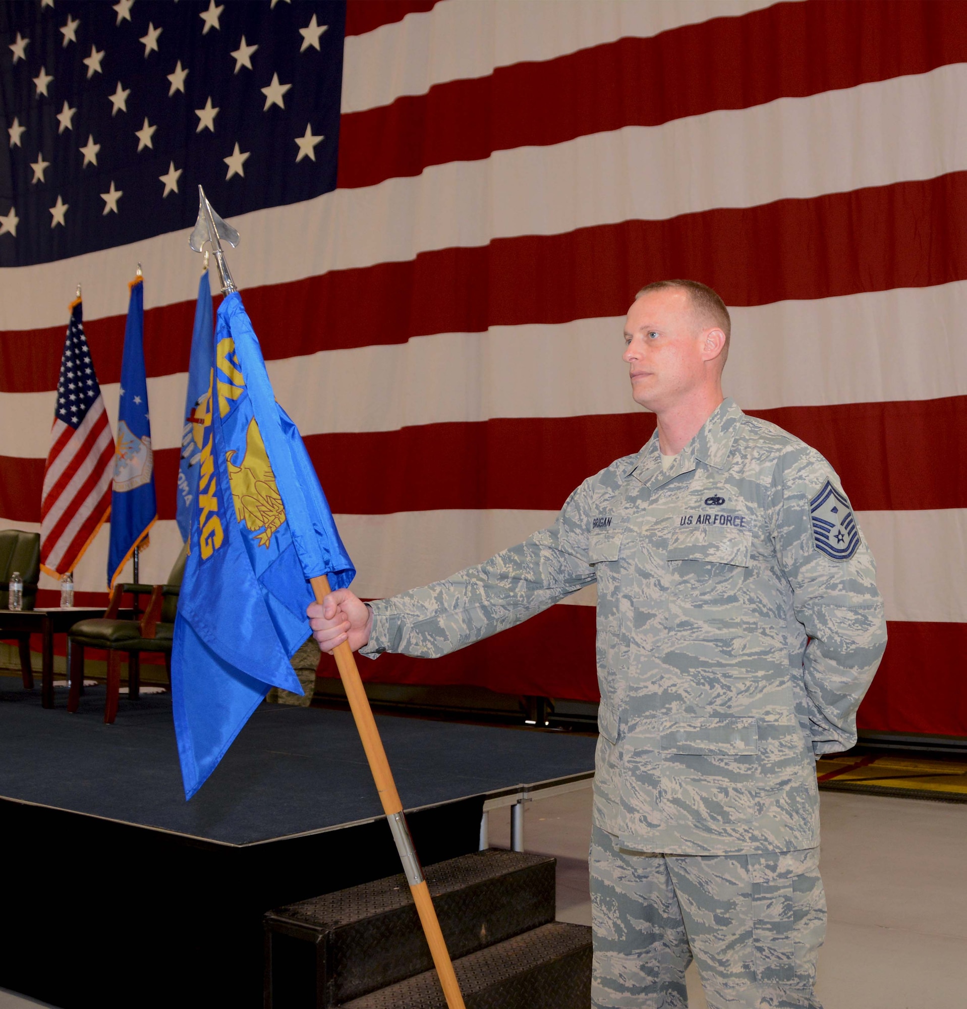 Senior Master Sgt. Christopher Brigan, 507th Maintenance Group first sergeant, wields the guidon during the 507th Maintenance Group assumption of command ceremony at Tinker Air Force Base, Oklahoma, April 7, 2019. (U.S. Air Force photo by Tech. Sgt. Samantha Mathison)
