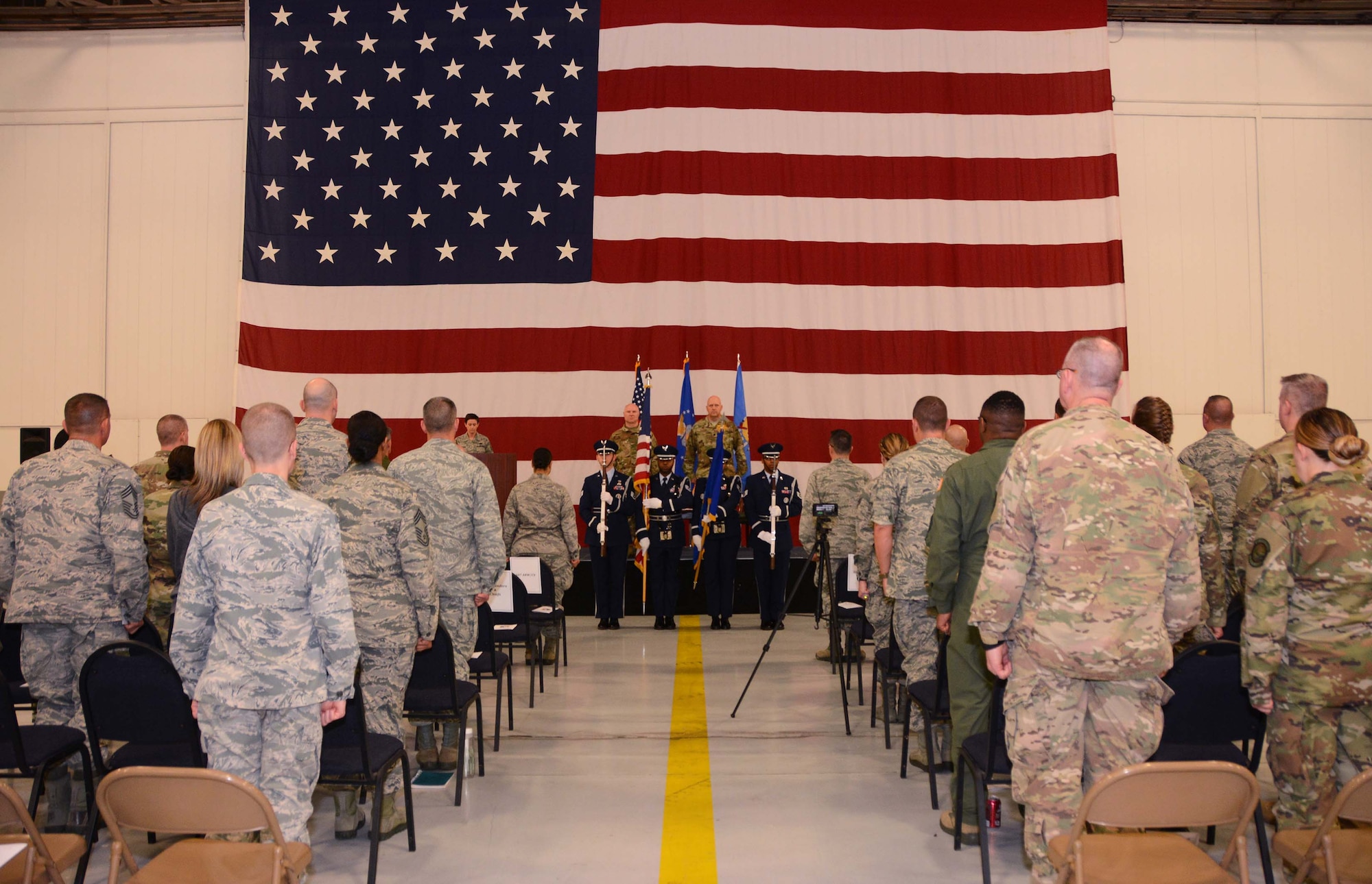 507th Air Refueling Wing commander, Col. Miles Heaslip, and Lt. Col. Karwin Weaver, stand at attention during the presentation of the colors at the 507th Maintenance Group assumption of command ceremony, Tinker Air Force Base, Oklahoma, April 7, 2019. (U.S. Air Force photo by Tech. Sgt. Samantha Mathison)