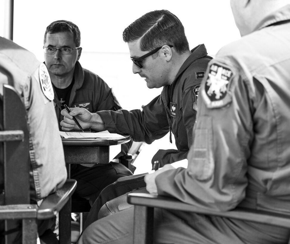 Capt. Andrew “Dojo” Olson, F-35 Demonstration Team pilot and commander conducts a pre-flight brief before his final certification flight March 2, 2019, at Davis-Monthan Air Force Base, Ariz. During pre-flight briefs, Olson evaluates the aerial maneuvers and considers variables that could potentially affect his performance such as wind direction, speed and cloud coverage. (U.S. Air Force photo by Senior Airman Alexander Cook)