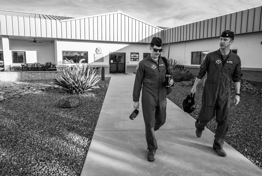 F-35 Demonstration Team pilot and commander, Capt. Andrew “Dojo” Olson and his wingman, Maj. Aaron “Gambit” Stevens, depart the 357th Fighter Squadron March 2, 2019, at Davis-Monthan Air Force Base, Ariz. Olson and his Wingman have spent the last seven months developing and refining the team’s new aerial demonstration which will showcase the F-35A Lighting II throughout the airshow season. (U.S. Air Force photo by Senior Airman Alexander Cook)