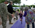 Joint Base San Antonio leaders, service members, teachers and school administrators greeted Fort Sam Houston Elementary School students before classes for “Purple Up! For Military Kids” day April 12. JBSA and San Antonio community members were encouraged to wear purple to recognize military children for their personal sacrifice and courage in supporting their military parents. The children were given purple beads by service members as they made their way to school. “Purple Up! For Military Kids” day commemorated the Month of the Military Child in April, which acknowledges the important role of military children and families worldwide in the armed forces, acknowledging the sacrifices they make and the challenges they overcome on a daily basis.