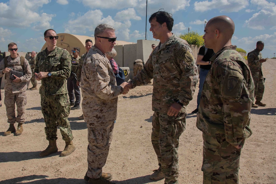 U.S. Marine Corps Gen. Kenneth F. McKenzie Jr., U.S. Central Command commander, left, shakes hands with military personnel during his visit to Syria, April 11, 2019. While touring the USCENTCOM area of responsibility, McKenzie met with forward deployed troops and reaffirmed the U.S. commitment to security and stability of the region. (U.S Army photo by Pfc. Adrian Pacheco)