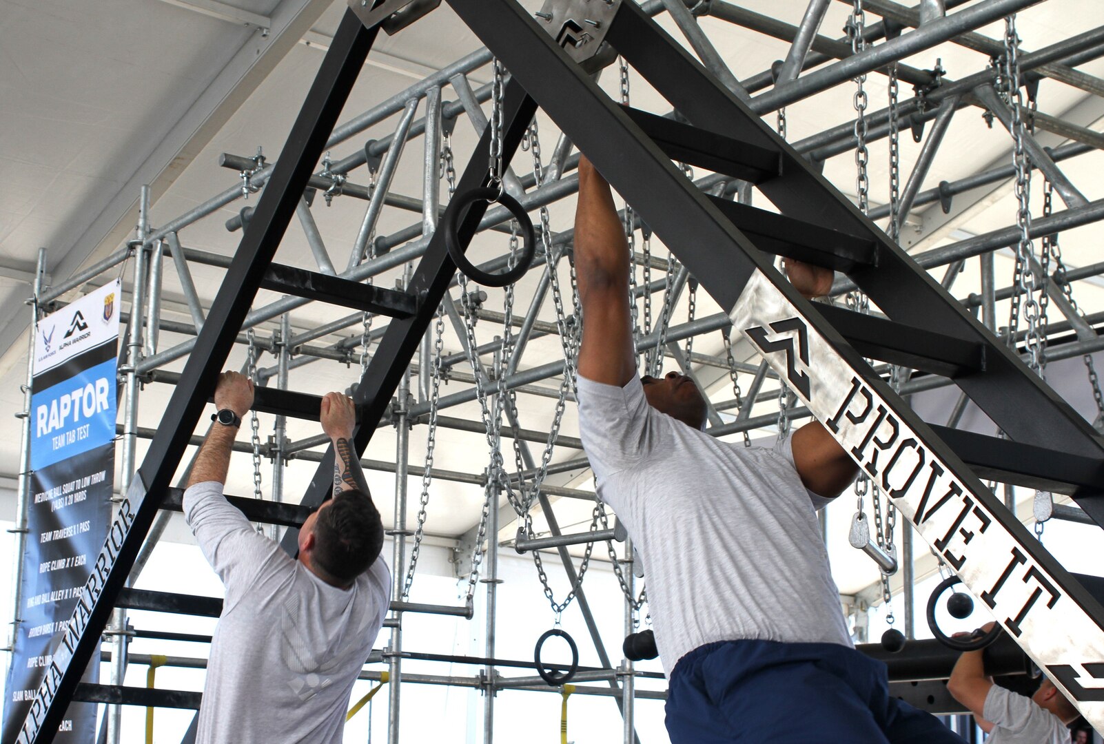 Two members of the Air Force Services Activity demonstrate one of nine stations on an Alpha Warrior Battle Rig during Industry Day April 9 at Joint Base San Antonio-Lackland. For many visiting senior Air Force leaders, this was the first time they’d had the opportunity to see up-close the various ways the equipment helps to build ready and resilient Airmen. In addition to the adult rig, a new youth rig that will be rolled out to 10 installations later this year was also on display and demonstrated by JBSA-Lackland youth.
