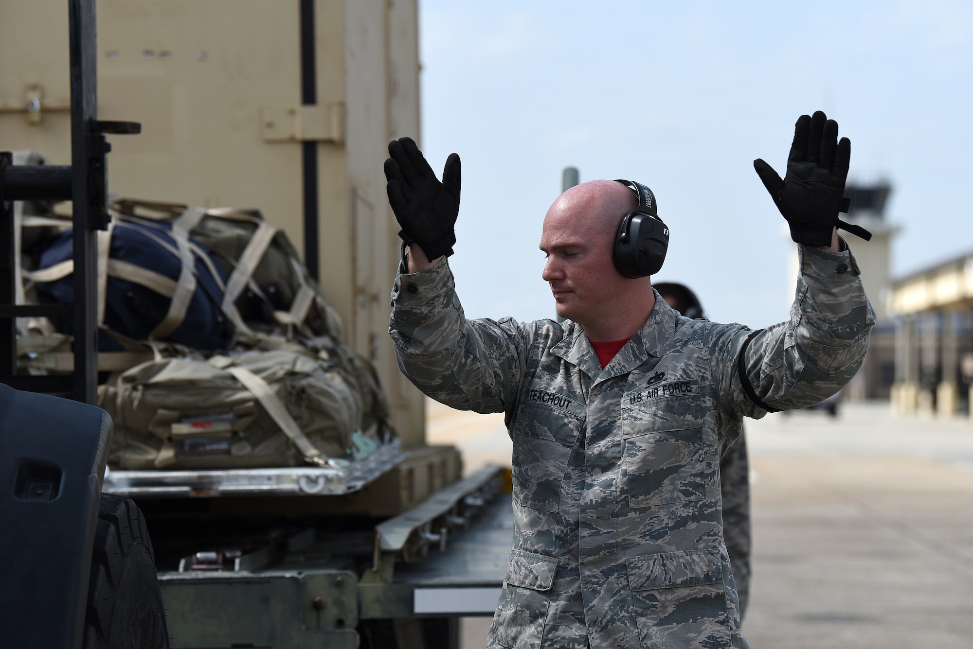 U.S. Air Force Tech. Sgt. Brian Teachout, 81st Logistics Readiness Squadron Small Air Terminal NCO in charge, directs a forklift operator to unload cargo in support of exercise Neptune Guardian on Keesler Air Force Base, Mississippi, April 5, 2019. The 81st LRS acted as a one-stop shop for ground and air transportation as well as munition requirements for joint exercise Neptune Guardian between the U.S. Coast Guard and U.S. Navy. (U.S. Air Force photo by Senior Airman Suzie Plotnikov)