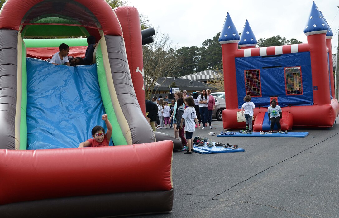 Children interact and play on the bouncy castles during the Youth Center’s Month of the Military Child, April 5, 2019, on Columbus Air Force Base, Miss. April is the Month of the Military Child, a time to acknowledge sacrifices and unique contributions made by military families worldwide while highlighting the strength of character and resilience which make military children an asset to our local communities and schools. (U.S. Air Force photo by Airman Hannah Bean)