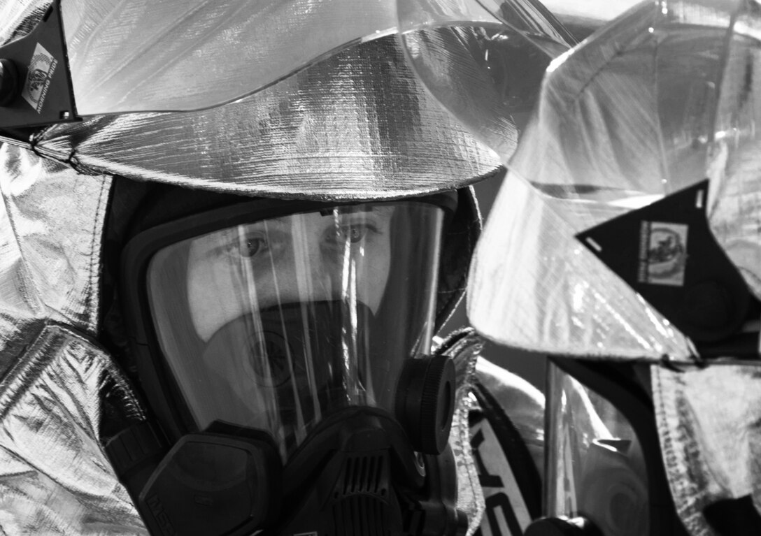 A U.S. Airman assigned to the 4th Civil Engineer Squadron fire department out of Seymour-Johnson Air Force Base, N.C., performs a buddy-check prior to beginning aircraft fire training at Shaw Air Force Base, S.C., April 11, 2019.