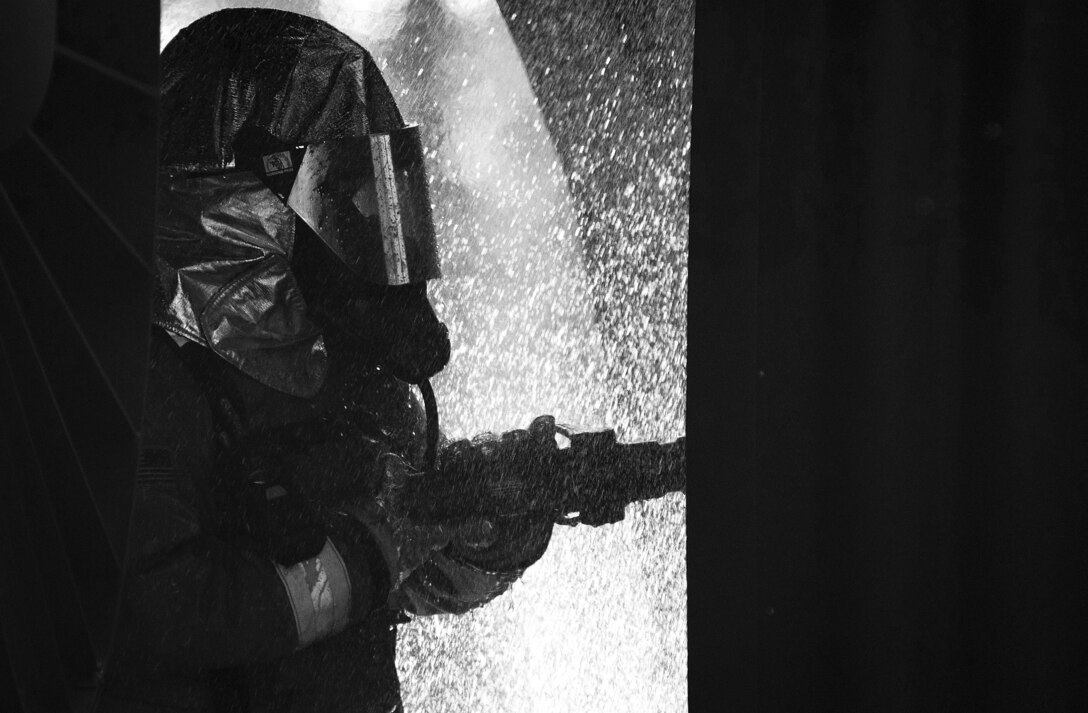 A U.S. Airman assigned to the 20th Civil Engineer Squadron fire department extinguishes a simulated aircraft fire at Shaw Air Force Base, S.C., April 11, 2019.