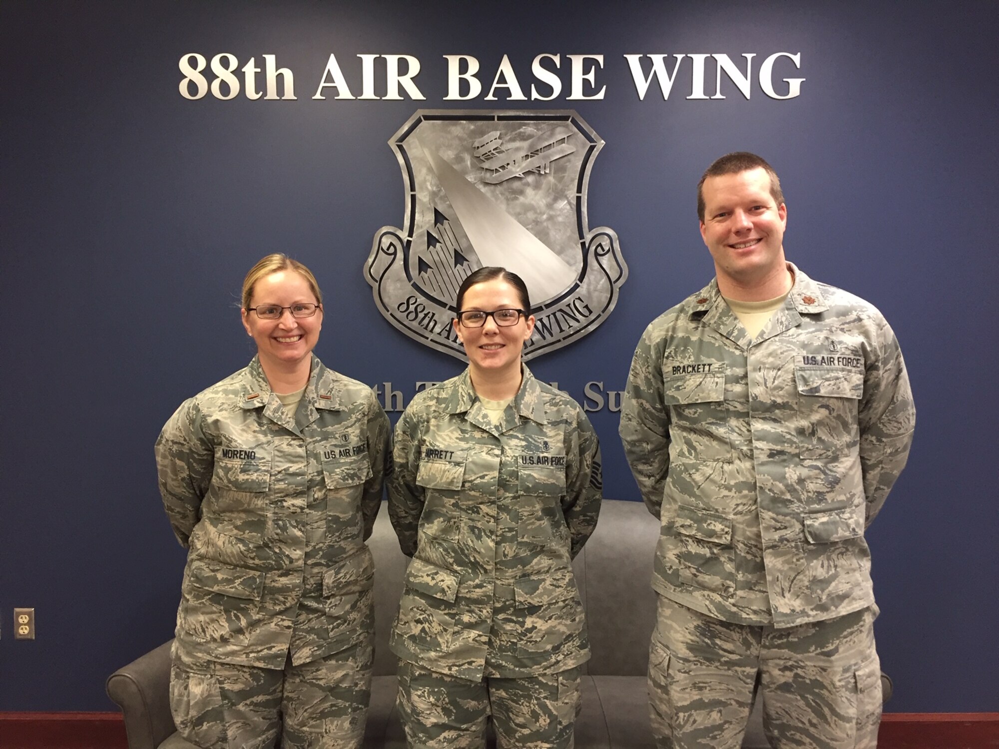 2nd Lt. Autumn Moreno, Master Sgt. Anna Garrett and Maj. Todd Brackett, left to right, are coordinating the 46th annual Air Force Assistance Fund campaign at Wright-Patterson Air Force Base. Moreno received assistance from the Air Force Aid Society when she was a young Airman and suddenly needed a plane ticket to get home after a family member died. (Skywrighter photo/Amy Rollins)