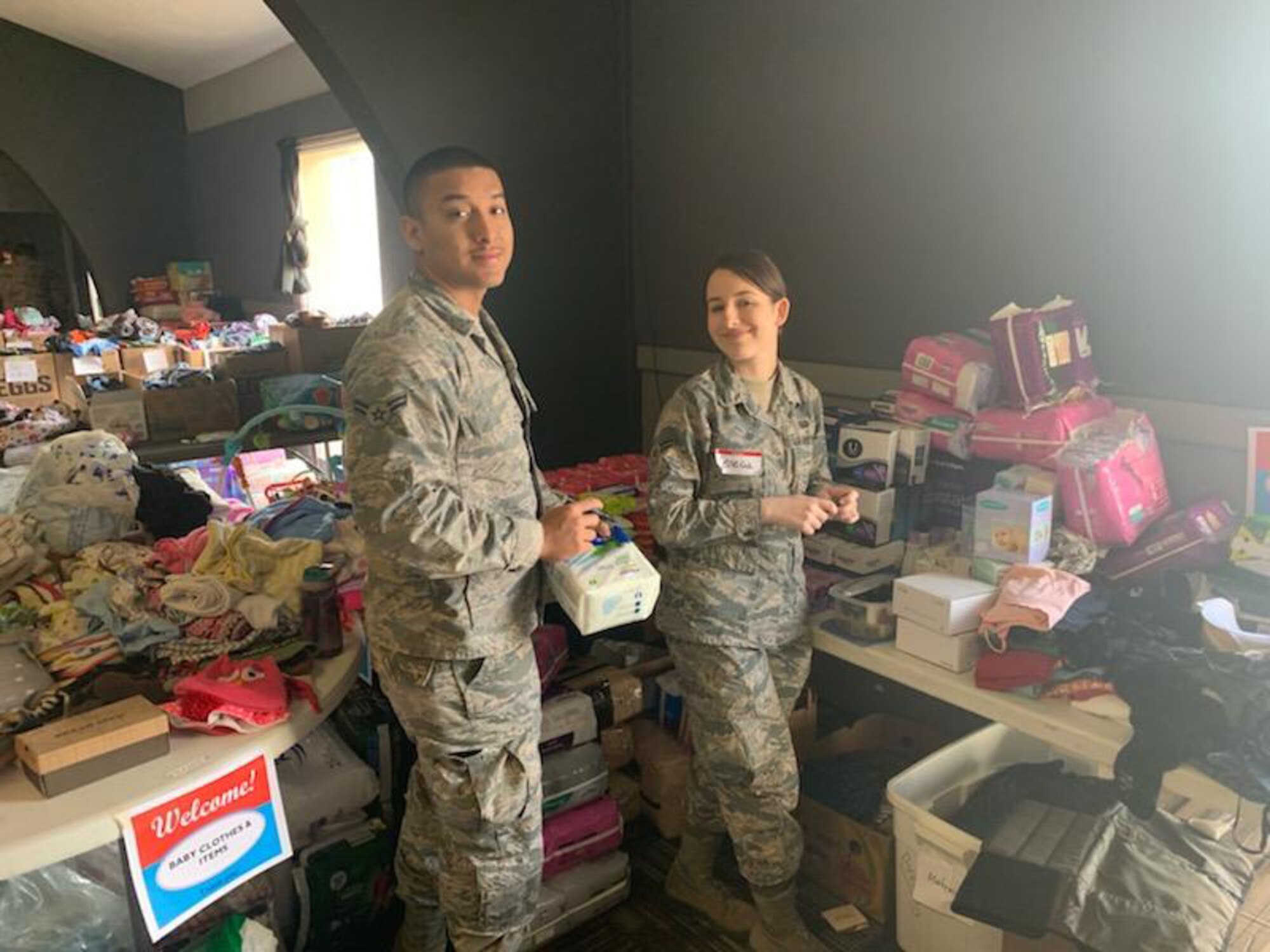U.S. Air Force Airmen with the 20th Intelligence Squadron, 363rd Intelligence, Surveillance and Reconnaissance Wing, sort and distribute clothes, cleaning supplies, toys and food at the Bellevue Christian Center in Nebraska, March 18-21, 2019. Airmen, civilian and industry partners from the 20th IS volunteered to provide assistance and relief efforts to those affected by recent flooding in Nebraska and Iowa. (Courtesy photo)