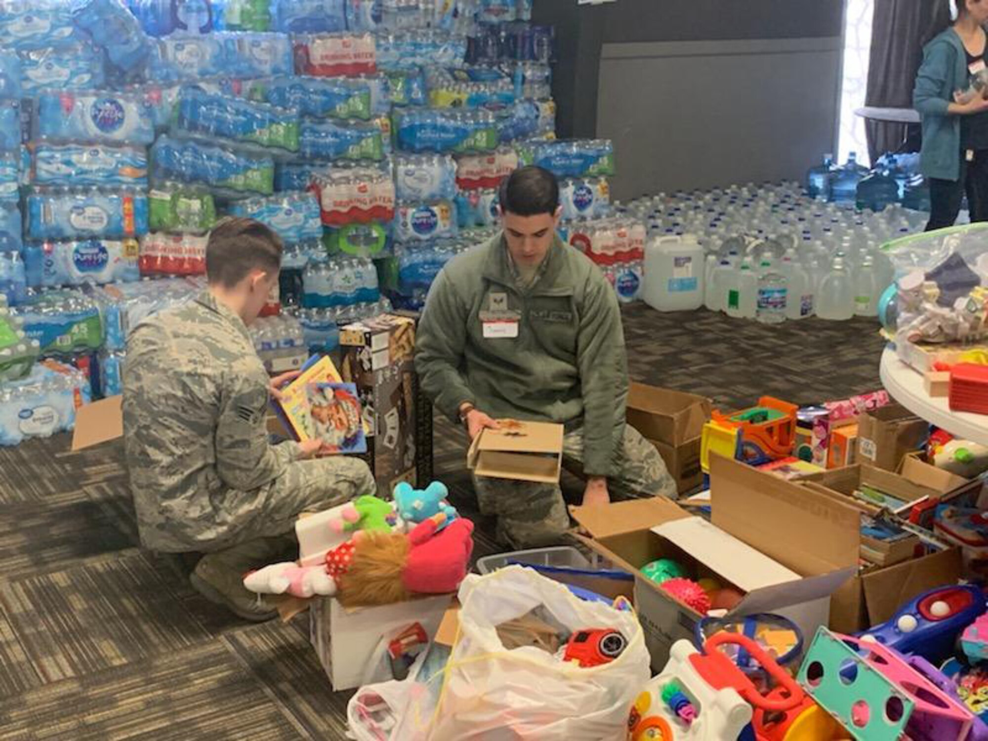 U.S. Air Force Airmen with the 20th Intelligence Squadron, 363rd Intelligence, Surveillance and Reconnaissance Wing, sort and distribute clothes, cleaning supplies, toys and food at the Bellevue Christian Center in Nebraska, March 18-21, 2019. Airmen, civilian and industry partners from the 20th IS volunteered to provide assistance and relief efforts to those affected by recent flooding in Nebraska and Iowa. (Courtesy photo)