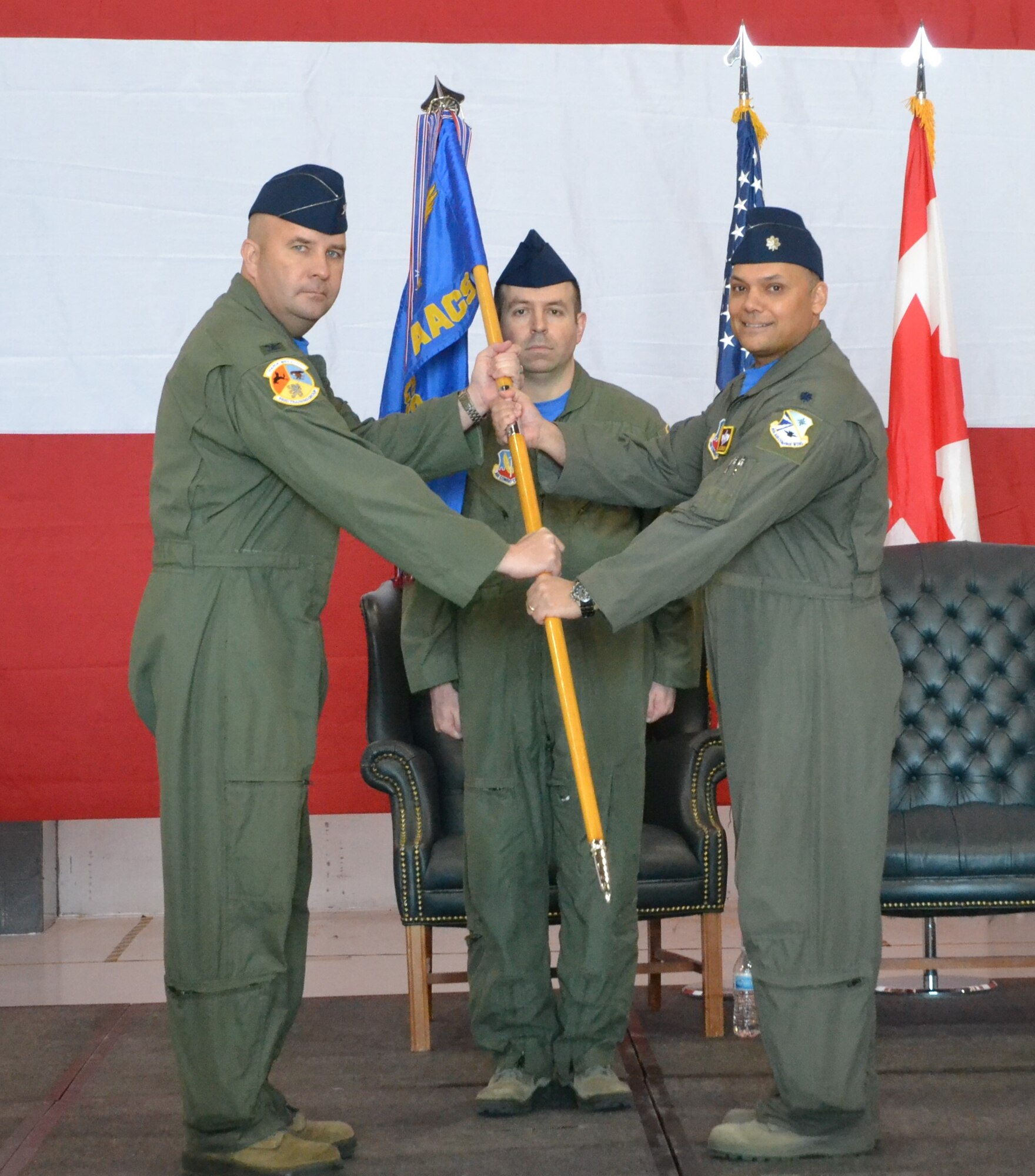 Lt. Col. Marty Slovinsky accepts command of the 966th Airborne Air Control Squadron in an official ceremony on April 12.  The change of command was presided over by Col. Stephen Carocci, commander of the 552nd Training Group while Senior Master Sgt. Richard Babcock, senior enlisted manager of the 966th AACS, served as the guidon bearer. (U.S. Air Force photo/2nd Lt. Ashlyn K. Paulson).
