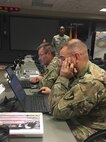 Members of Task Force Operations collaborate during a break-out session at a mission planning conference hosted at Joint Task Force Civil Support (JTF-CS) headquarters at Fort Eustis, Va. April 9-11. The main focus of the conference was to prepare for an upcoming major disaster-response training exercise and the Defense Chemical, Biological, Radiological and Nuclear Response Force (DCRF) mission. The attendees represented JTF-CS and units comprising four task forces including operations, medical, logistics and aviation, and other organizations preparing for Exercise Vibrant Response-Guardian Response 2019 which will be held in locations in Michigan, Indiana and some support in Texas, April 29-May 6. (Official DoD photo by Army 1LT Lindsey Riordan/released)