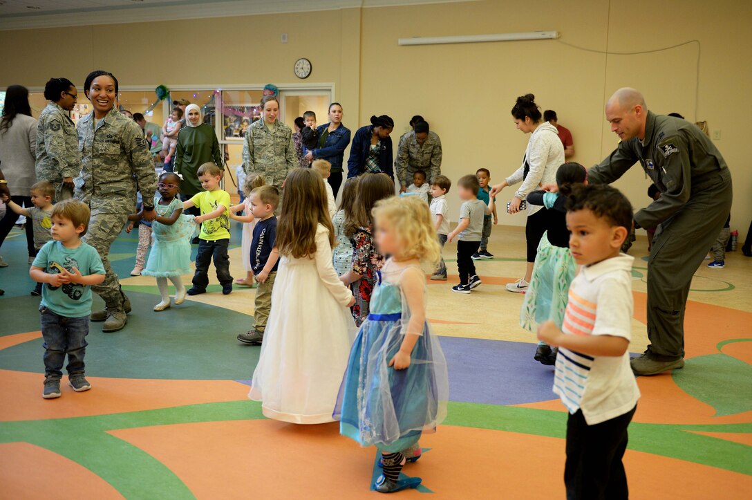 Parents dance with their Children the Child Development Center Ball dress up and dance, April 5, 2019, on Columbus Air Force Base, Miss. Sponsored by the Department of Defense Military Community and Family Policy, the Pentagon, military branches and other agencies use the month to recognize military kids for their bravery on the home front. (U.S. Air Force photo by Airman Hannah Bean)