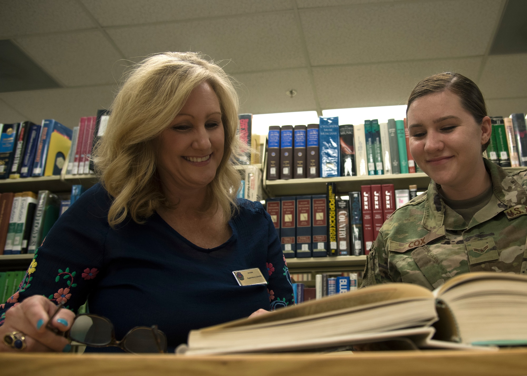 Jennifer Crowell, 56th Force Support Squadron library director, shelves a book April 8, 2019, at Luke Air Force Base, Ariz.