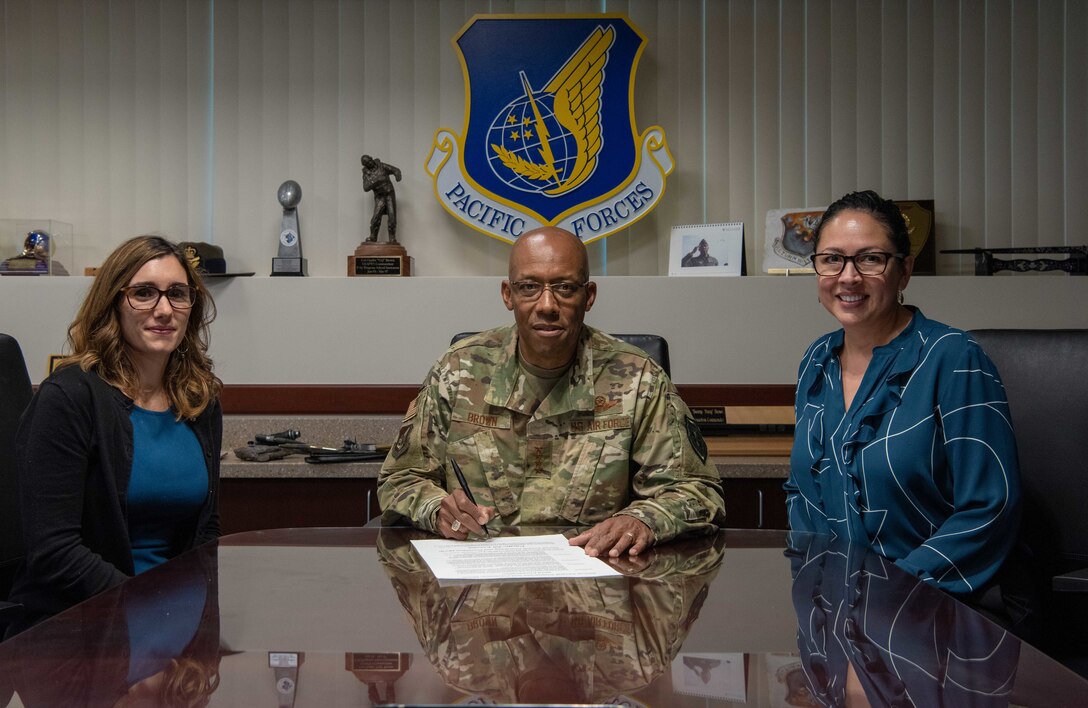 Gen. CQ Brown, Jr., Pacific Air Forces commander, poses for a photo with Abigail Cutter, Pacific Air Forces Deputy Sexual Assault response coordinator (left), and Dr. Lisa Charles, Pacific Air Forces Sexual Assault Prevention and Response program manager (right), at Joint Base Pearl Harbor-Hickam, Hawaii, Mar. 11, 2019.