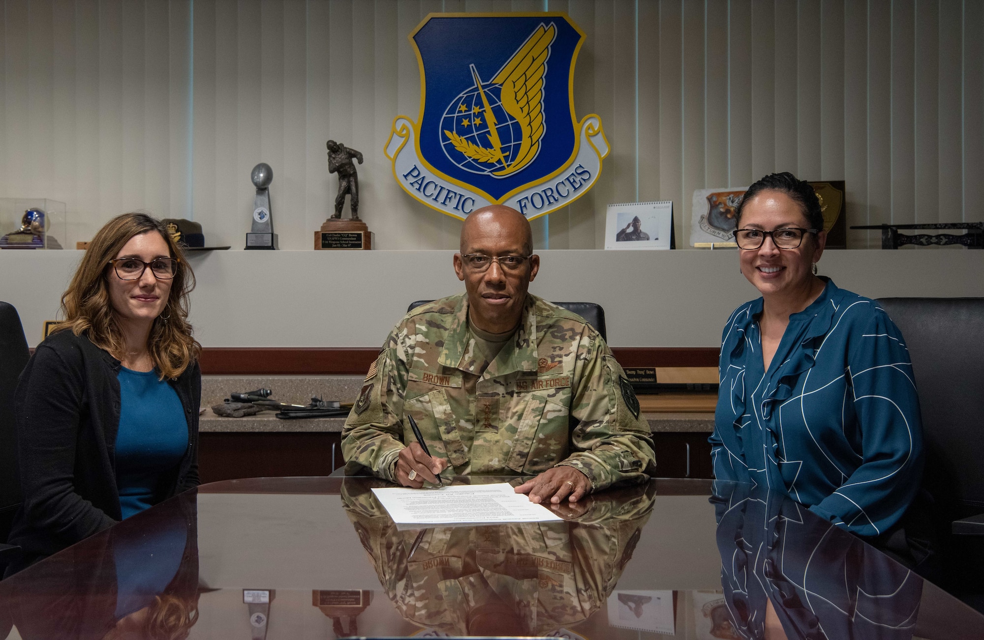 Gen. CQ Brown, Jr., Pacific Air Forces commander, poses for a photo with Abigail Cutter, Pacific Air Forces Deputy Sexual Assault response coordinator (left), and Dr. Lisa Charles, Pacific Air Forces Sexual Assault Prevention and Response program manager (right), at Joint Base Pearl Harbor-Hickam, Hawaii, Mar. 11, 2019.