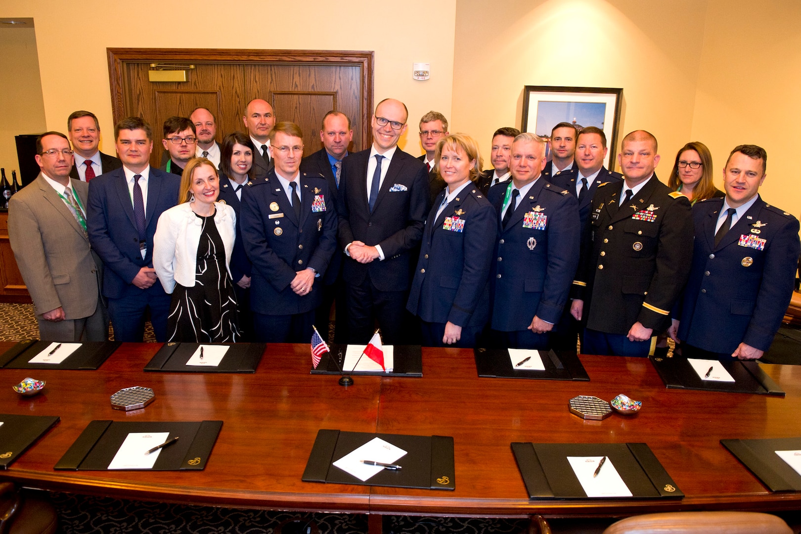 U.S. Space representatives within the Department of Defense pose for a group photo with Michal Szaniawski, acting president of the Polish Space Agency, following the signing of an agreement for space situational awareness (SSA) services and data at the 35th Space Symposium in Colorado Springs, Colo., April 10, 2019. Szaniawski signed the agreement as part of a larger effort to support spaceflight planning and enhance the safety, stability and sustainability of space operations. Poland joins 18 nations, two intergovernmental organizations, and 77 commercial satellite owners, operators, launchers already participating in SSA data-sharing agreements with USSTRATCOM.
