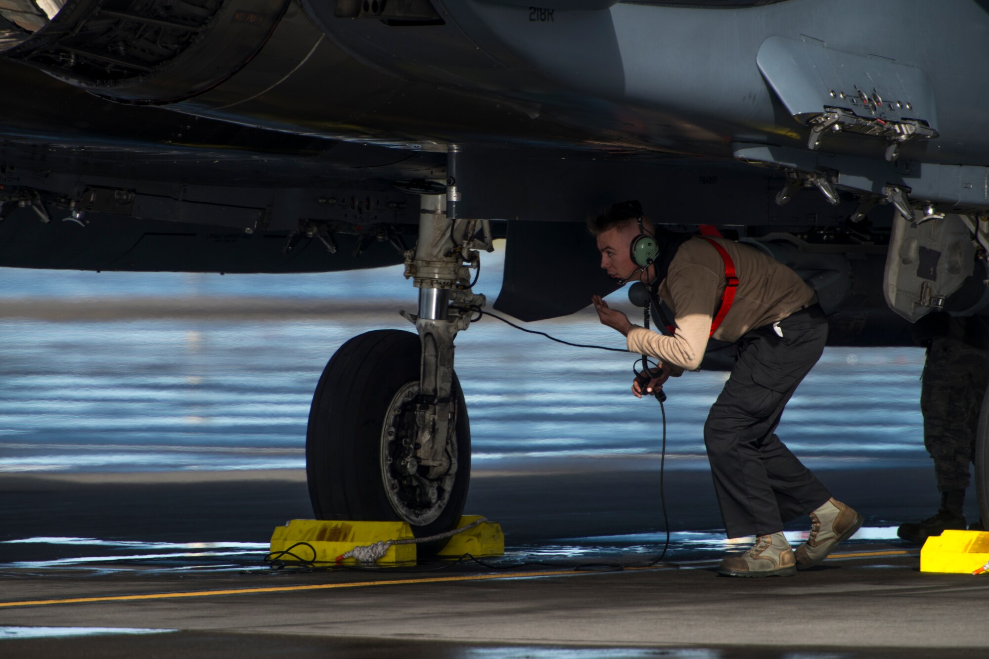 A 389th Fighter Squadron crew chief performs a pre-flight inspection on an F-15E Strike Eagle during Gunfighter Flag, April 5, 2019 at Mountain Home Air Force Base, Idaho. The exercise Gunfighter Flag is held once a quarter to hone skills of 366th Fighter Wing Airmen. (U.S. Air Force photo by Airman 1st Class JaNae Capuno)