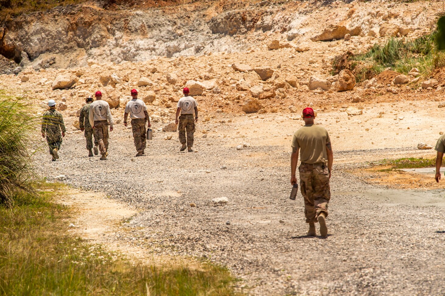 ANDERSEN AIR FORCE BASE, Guam (April 9, 2019) Sailors assigned to Naval Mobile Construction Battalion 133 (NMCB) and airmen assigned to 554th Rapid Engineer Deployable Heavy Operational Repair Squadron Engineers (RED HORSE) inspect the quarry explosion site after the completion of the joint demolition at Anderson Air Force Base’s quarry. NMCB-133, provides expeditionary construction and engineering capabilities that includes maintenance and operation of expeditionary bases and facilities, tactical sustainment bridging, humanitarian assistance through construction civic action details and civic action teams and theater disaster response capabilities in the U.S. 7th Fleet area of operations.