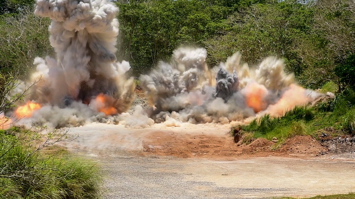 ANDERSON AIR FORCE BASE, Guam (April 9, 2019) Debris from an explosion fills the air during joint quarry operations conducted by Sailors assigned to Naval Mobile Construction Battalion 133 (NMCB) and Airmen assigned to 554th Red Horse Squadron at Anderson Air Force Base’s quarry. NMCB conducted the demolition in order to maintain proficiency in blast operations that support construction and repair efforts in the region. NMCB-133, provides xpeditionary construction and engineering capabilities that includes maintenance and operation of expeditionary bases and facilities, tactical sustainment bridging, humanitarian assistance through construction civic action details and civic action teams and theater disaster response capabilities in the U.S. 7th Fleet area of operations.