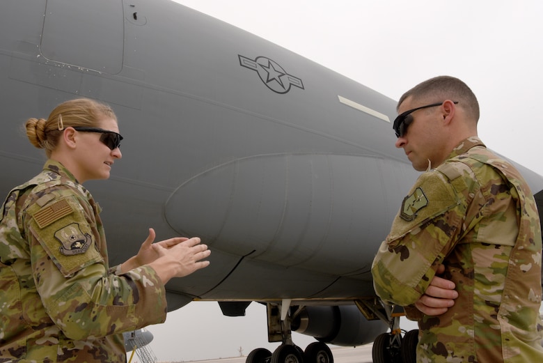 U.S. Air Force 1st Lt. M. Rebecca Kretzer, 380th Expeditionary Maintenance Group Depot Liaison Engineer, discusses common maintenance requests during turnover with her replacement, Maj. Joseph Czabaranek, April 11, 2019.