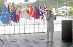 CHUUK, Federated States of Micronesia (April 13, 2019) Royal Navy Capt. Paddy Allen, director of mission, speaks during the opening ceremony aboard the Military Sealift Command expeditionary fast transport ship USNS Brunswick (T-EPF 6) during Pacific Partnership 2019. Pacific Partnership, now in its 14th iteration, is the largest annual multinational humanitarian assistance and disaster relief preparedness mission conducted in the Indo-Pacific. Each year, the mission team works collectively with host and partner nations to enhance regional interoperability and disaster response capabilities, increase stability and security in the region, and foster new and enduring friendships in the Indo-Pacific.