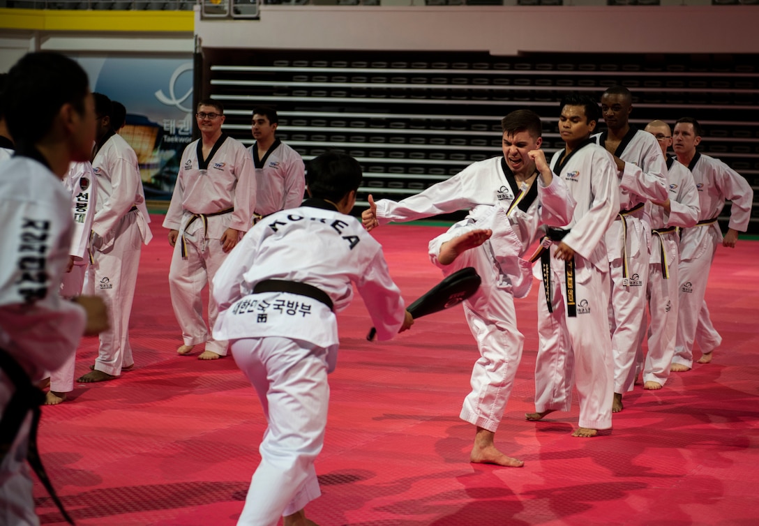 Members from the United States Forces-Korea learn the basics of Taekwondo with Republic of Korea Army soldiers  during a Korean Ministry of Defense tour at Muju, Republic of Korea, April 9, 2019. The MND has been organizing and hosting tours for U.S. service members since 1972, giving them several opportunities to learn about the history and culture of Korea. (U.S. Air Force photo by Senior Airman Stefan Alvarez)