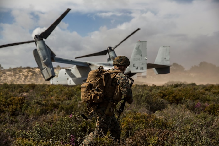 A U.S. Marine with Special Purpose Marine Air-Ground Task Force-Crisis Response-Africa 19.2, Marine Forces Europe and Africa, extracts from the landing zone on an MV-22B Osprey during a Tactical Recovery of Aircraft and Personnel exercise in Troia, Portugal, April 5, 2019