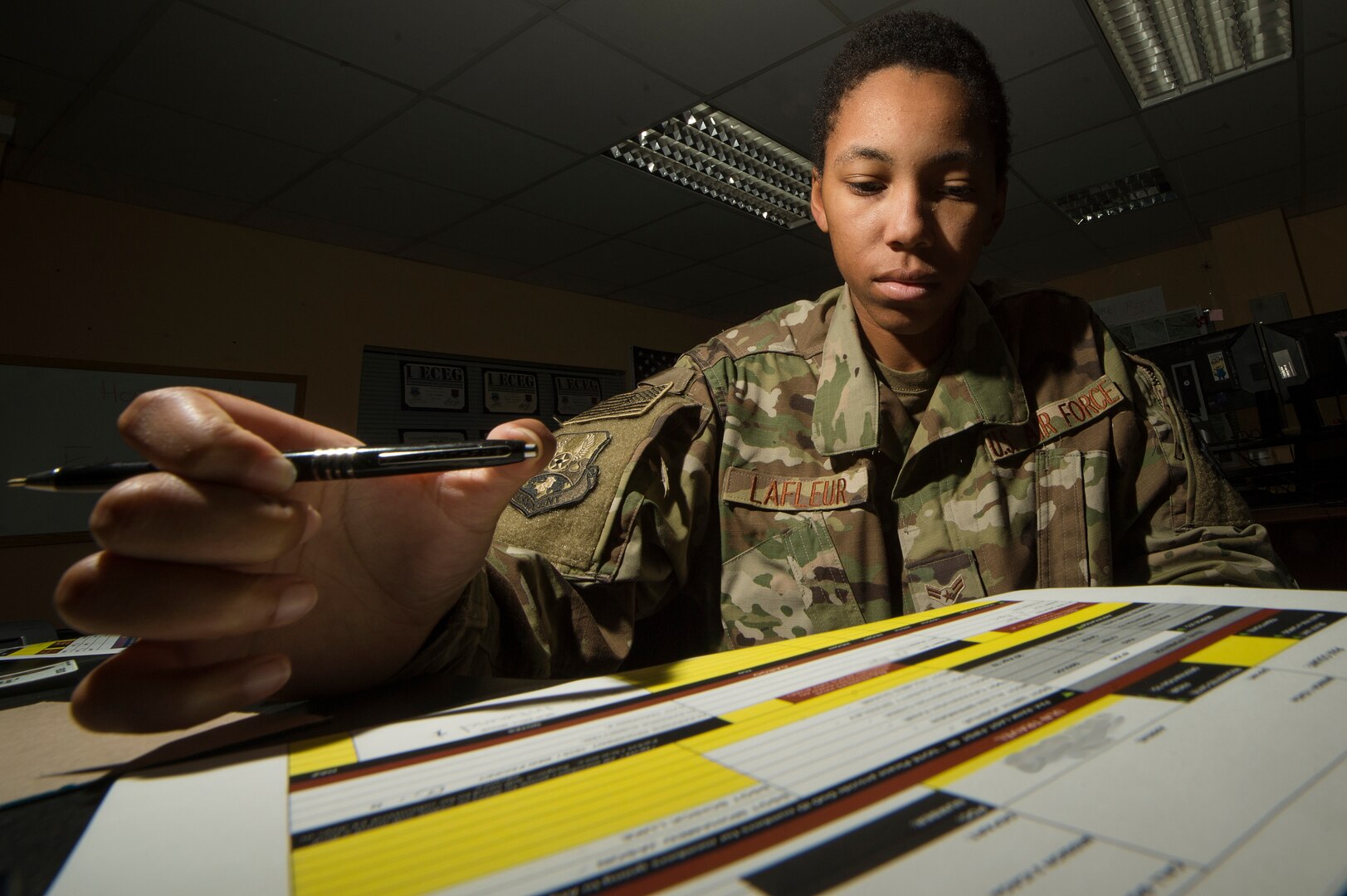 U.S. Air Force Airman 1st Class Evanah Lafleur, 557th Expeditionary RED HORSE Squadron logistics planner, verifies inbound passenger information at Al Udeid Air Base, Qatar, April 3, 2019. Lafleur is responsible for coordinating the movement of civil engineers and cargo to construction sites at deployed locations across U.S. Central Command (CENTCOM). Logistics Airmen were vital in the completion of more than 400 construction missions across the CENTCOM theater during a six-month period. (U.S. Air Force photo by Tech. Sgt. Christopher Hubenthal)