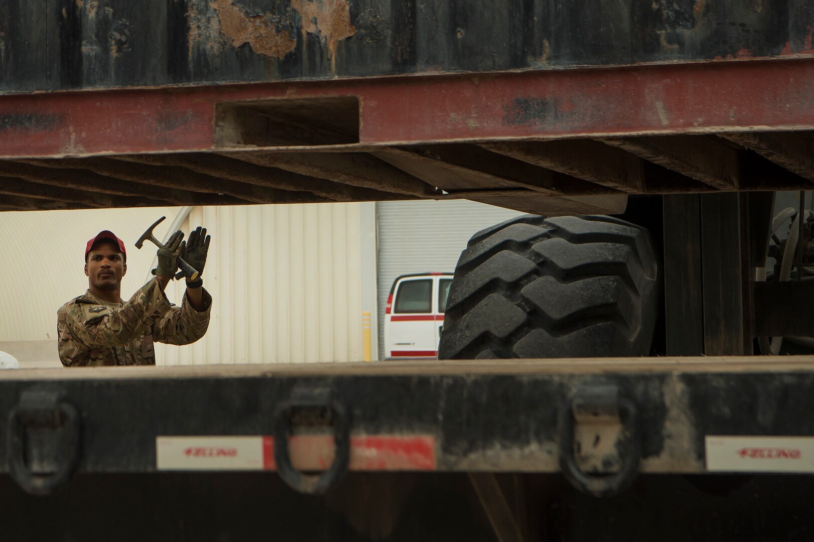 Staff Sgt. Sterling Benford, 557th Expeditionary RED HORSE Squadron supply NCO in charge, guides the movement of a large container at Al Udeid Air Base, Qatar, April 3, 2019. Benford is responsible for the accountability of 1st Expeditionary Civil Engineer Group assets at deployed locations across U.S. Central Command (CENTCOM). Logistics Airmen were vital in the completion of more than 400 construction missions across the CENTCOM theater during a six-month period. (U.S. Air Force photo by Tech. Sgt. Christopher Hubenthal)