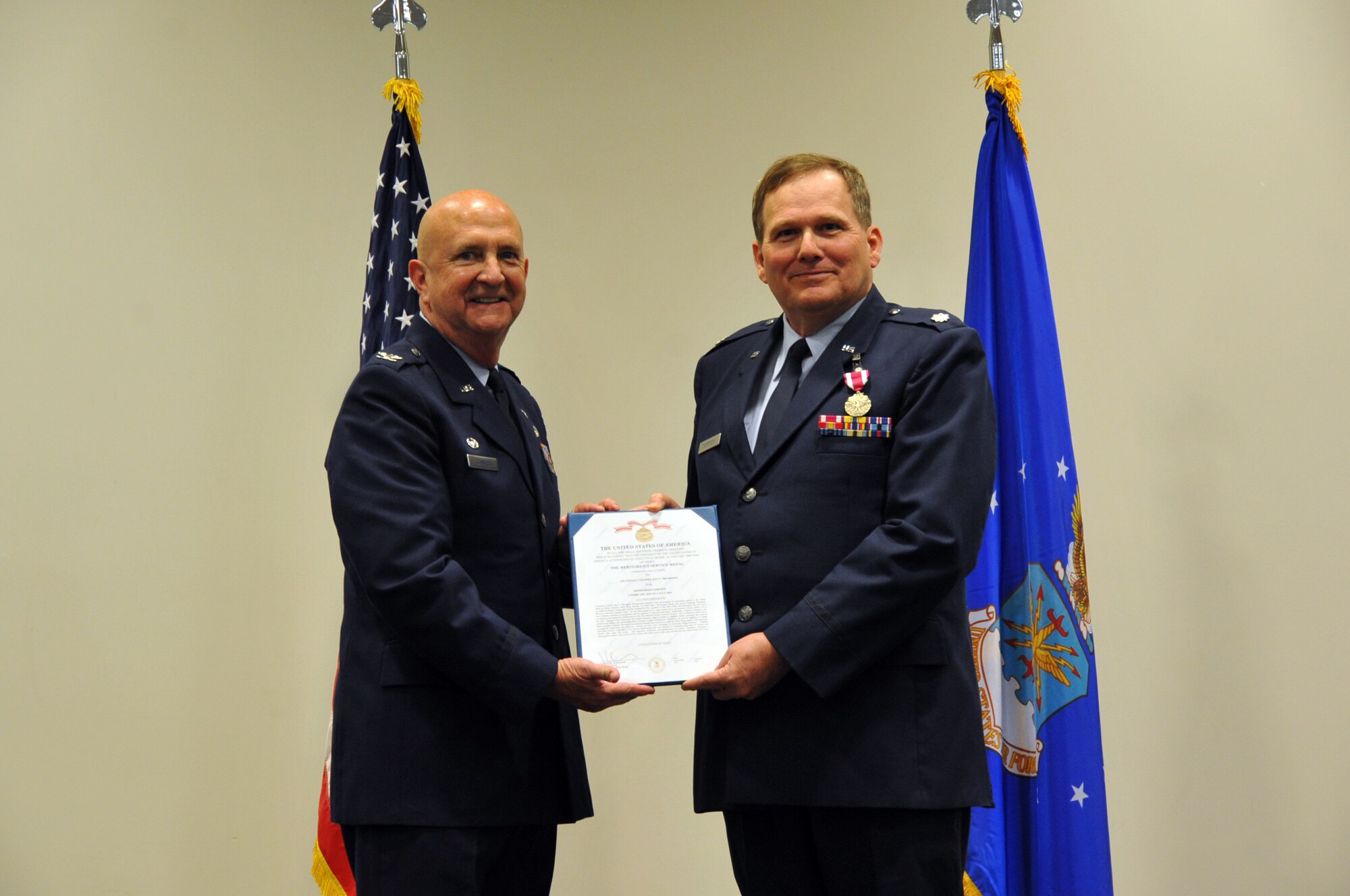 Col. Jay Johnson, 403rd Maintenance Group commander, presents Chaplain Lt. Col. R. Patrick Thompson, Wing Chaplain for the 403rd Wing, his Meritorious Service Medal at his retirement ceremony during the April Unit Training Assembly at the Roberts Maintenance Facility, Keesler Air Force Base, Miss. Chaplain Thompson's official retirement date is July 2, 2019 on his birthday. (U.S. Air Force photo by Master Sgt. Jessica L. Kendziorek)