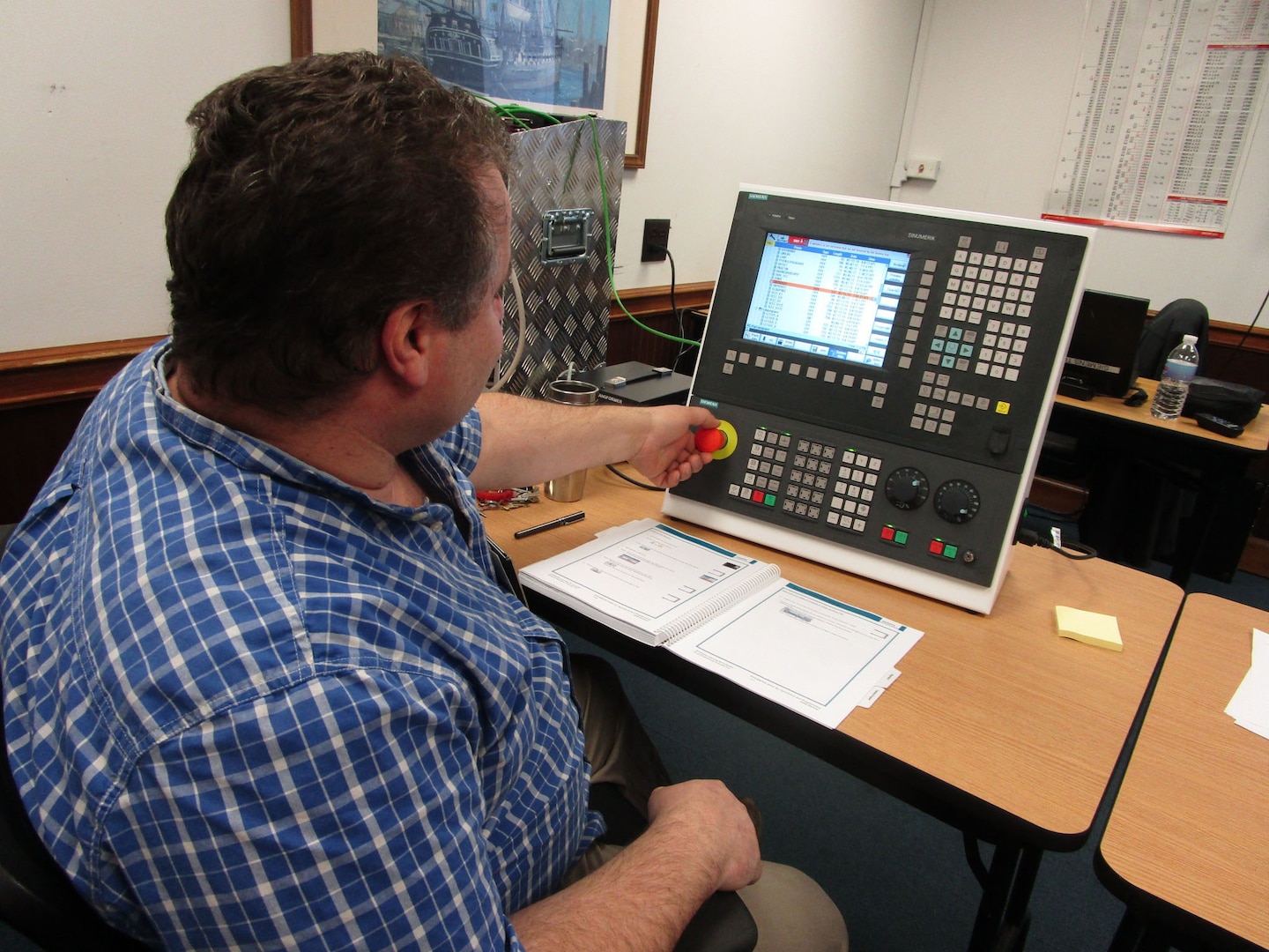Training Instructor Frank Jandris Uses a Profiling Machine Simulator
