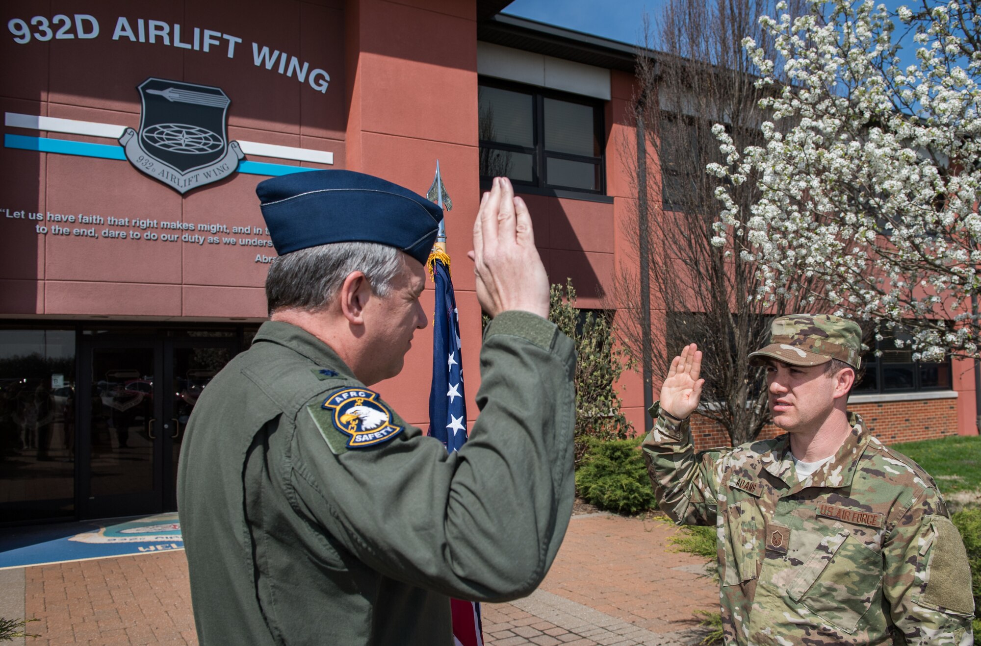 Master Sgt. Eric Adams, 932nd Airlift Wing flight safety noncommissioned officer in charge, recites the Oath of Enlistment, given to him by Lt. Col. Mike Louer, 932nd AW chief of safety, April 7, 2019, Scott Air Force Base, Illinois.  (U.S. Air Force photo by Master Sgt. Christopher Parr)