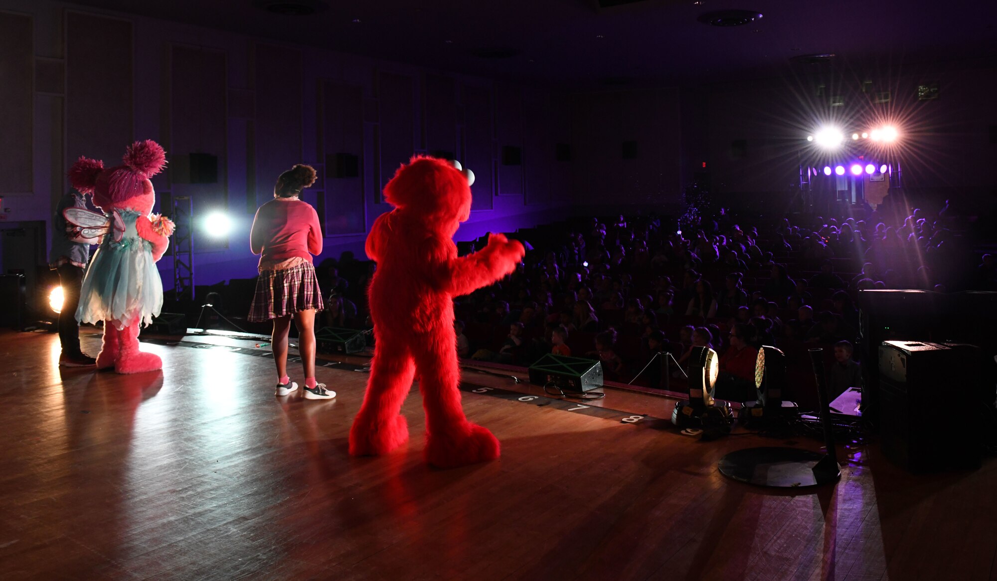 Character from Sesame Street Live sing and dance for families at the base theater on Ellsworth Air Force Base, S.D., March 28, 2019. Families were able to get up close and personal with their favorite characters while singing, dancing and learning about the importance of community.  (U.S. Air Force photo by Airman 1st Class Christina Bennett)