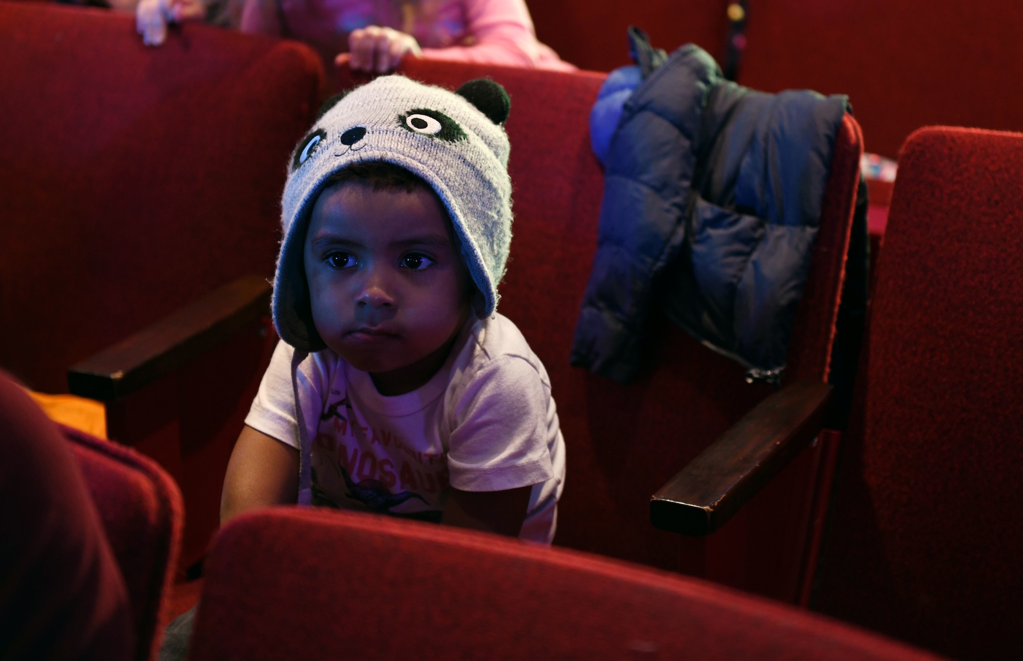 Jonathan Vazquez Jr., the son of Airman 1st Class Christina Bennett, a 28th Bomb Wing Public Affairs photojournalist, waits for Sesame Street Live to begin at the base theater on Ellsworth Air Force Base, S.D., March 28, 2019. Families were able to get up close and personal with their favorite characters while singing, dancing and learning about the importance of community. (U.S. Air Force photo by Airman 1st Class Christina Bennett)