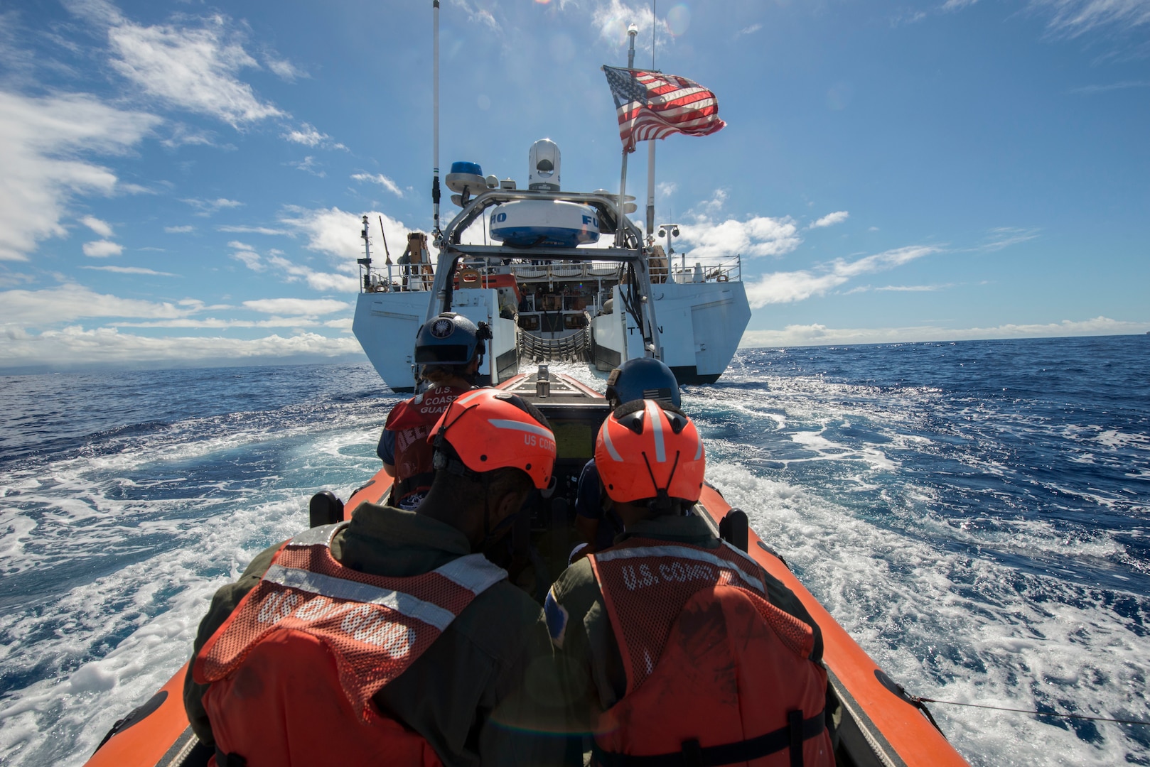 Coast Guard Cutter Stratton's crewmembers aboard Coast Guard small boat return to Stratton after a humanitarian assistance/disaster relief event for Rim of Pacific Exercise 2016, Wednesday, July 13, 2016. Twenty-six nations, 49 ships, six submarines, about 200 aircraft, and 25,00 personnel are participating in RIMPAC from June 29 to Aug. 4 in and around the Hawaiian Islands and Southern California. The world's largest international maritime exercise, RIMPAC provides a unique training opportunity while fostering and sustaining cooperative relationships between participants critical to ensuring the safety of sea lanes and security on the world's oceans. RIMPAC 2016 is the 25th exercise in the series that began in 1971.