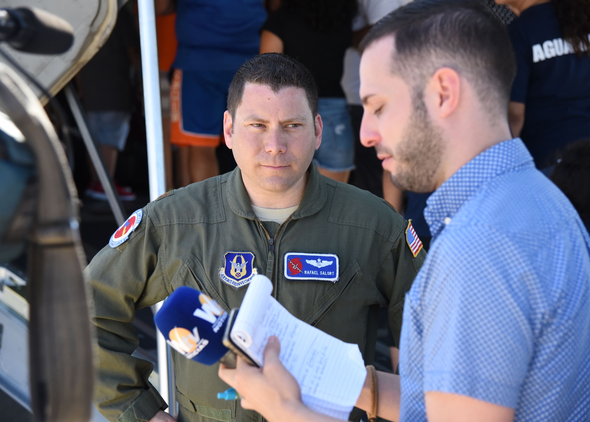 Maj. Rafael Salort, 53rd Weather Reconnaissance Squadron navigator and mission commander, conducts an interview with media at the Rafael Hernández Airport, Aguadilla, Puerto Rico, April 13, 2019. NOAA hurricane specialists and the U.S. Air Force Reserve Hurricane Hunters discussed hurricane preparedness, resilience and how they can become “weather-ready” during the 2019 Caribbean Hurricane Awareness Tour April 8-13, 2019. As part of the event dignitaries, students and the public toured the Air Force Reserve Command’s WC-130J “Hurricane Hunter” aircraft to learn how scientists collect hurricane information. (U.S. Air Force photo/Lt. Col. Marnee A.C. Losurdo)