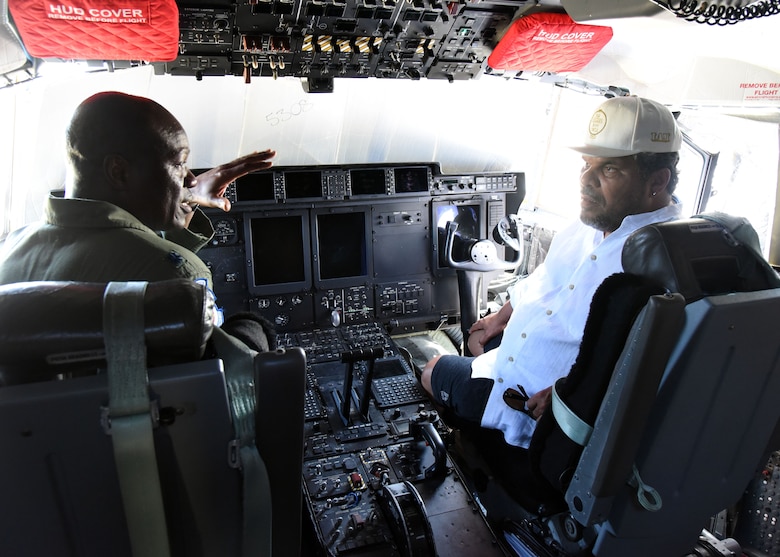 Lt. Col. Darryl Woods, 53rd Weather Reconnaissance Squadron pilot, explains the Air Force Reserve Hurricane Hunter mission to Luis Guzmán, the Puerto Rican actor, during the Caribbean Hurricane Awareness Tour April 13, 2019, at the Rafael Hernández Airport, Aguadilla, Puerto Rico. NOAA hurricane specialists and the U.S. Air Force Reserve Hurricane Hunters discussed hurricane preparedness, resilience and how they can become “weather-ready” during the event April 8-13, 2019. Dignitaries, students and the public toured the Air Force Reserve Command’s WC-130J “Hurricane Hunter” aircraft to learn how scientists collect hurricane information. (U.S. Air Force photo/Lt. Col. Marnee A.C. Losurdo)