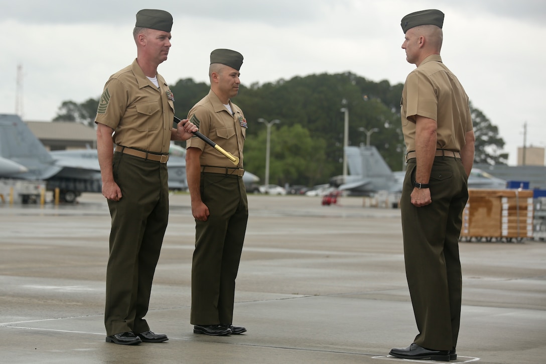 Sgt. Maj. Michael Lambert and Sgt. Maj. Jorge A. Guerrero stand at attention during Marine All Weather Fighter Attack Squadron 224's Relief and Appointment ceremony aboard Marine Corps Air Station Beaufort, April 12. During the ceremony, Guerrero relieved Lambert of his duties as sergeant major of VMFA(AW)-224.