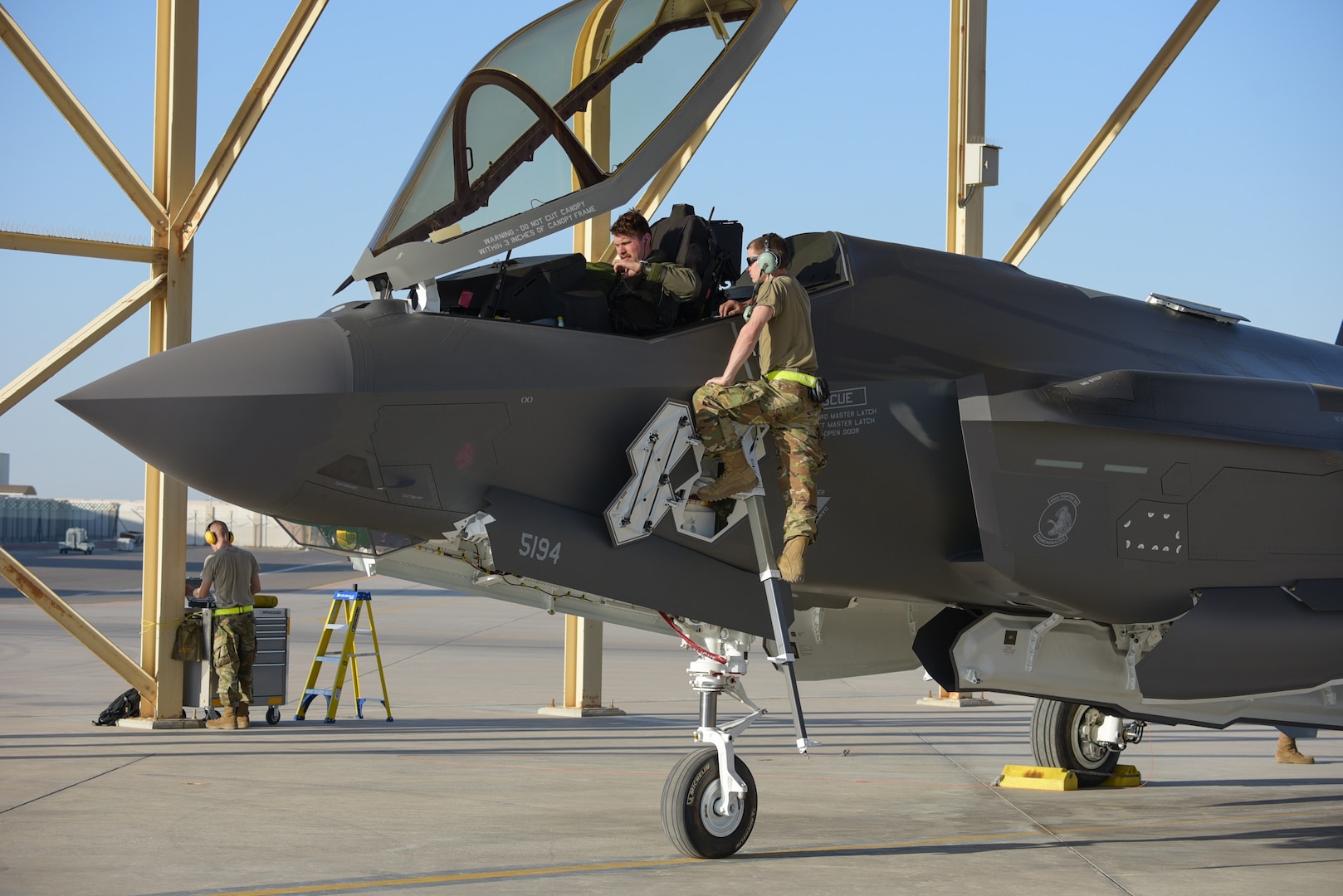 A photo of crew chiefs meeting a pilot of F-35A Lightning II