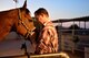 Maj. Travis, deputy of the 432nd Wing Staff Agency Commander’s Action Group and survivor of an almost deadly motorcycle accident, greets his horse, Indy, in Las Vegas, Nevada, Aug. 14, 2018. Along with physical therapy after the crash, he credits a large part of that recovery to his horse, Indy. His motivation to gain back the rhythm, comfort level and physical conditioning he’d once had with her is what helped in building back his physical strength. (U.S. Air Force photo by Airman 1st Class Haley Stevens)