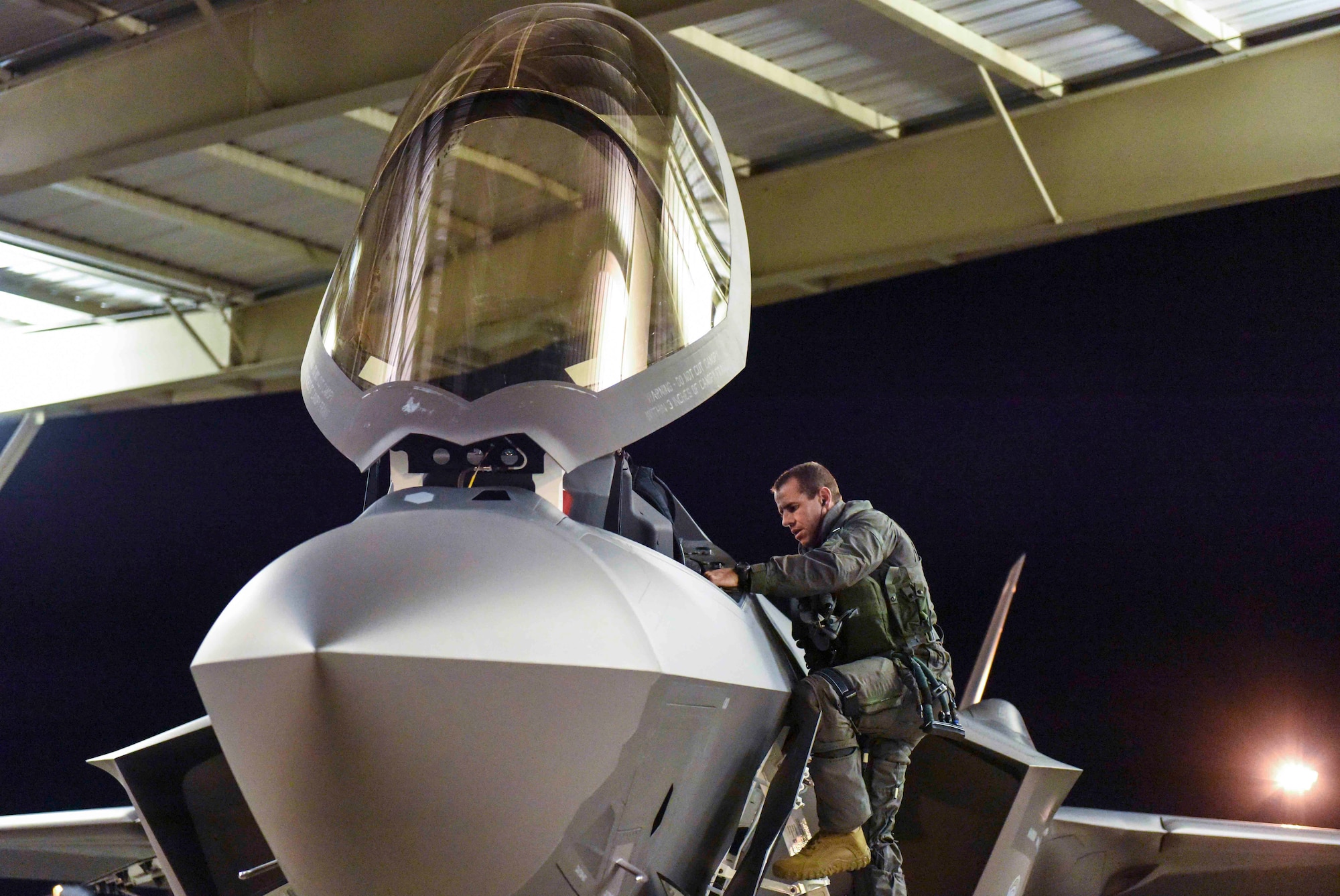 Lt. Col. Shad “Polo” Stromberg, F-35 pilot in the 419th Fighter Wing, steps to his jet for a nighttime deployment departure to Al Dhafra Air Base, United Arab Emirates from Hill Air Force Base, Utah last week